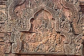 Banteay Srei temple - Shiva on Mount Kailasa (southern library east pediment) Uma sits on his lap. The ten-headed demon Ravana is shaking the mountain